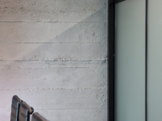 office grey roughcast concrete wall panel - muros