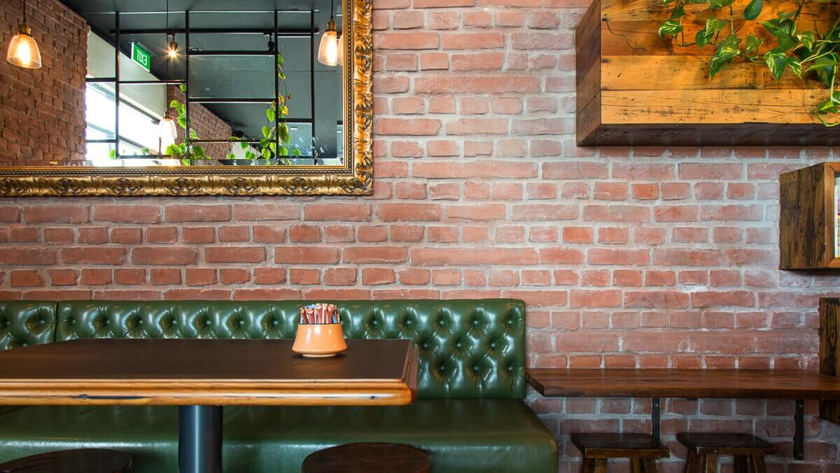 Authentic textured Muros Burnt Red Loft Brick wall panels deliver a traditional London brick ambience
