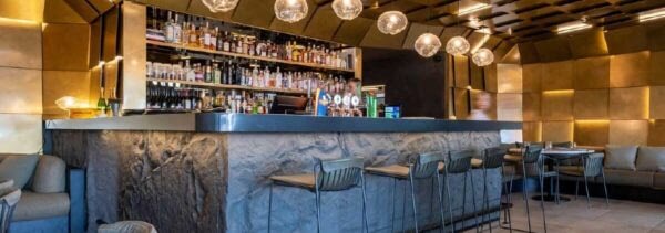 Muros Rock panels painted weth Resene black colour in hospitality fitout.