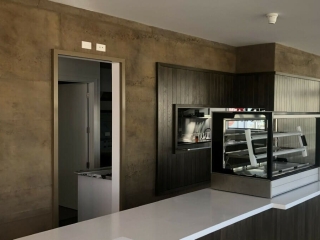 Commercial Hospitality Rust Roughcast Concrete Kitchen