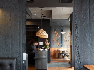 Commercial Hospitality Black Roughcast Concrete Cavity Sliding Doors